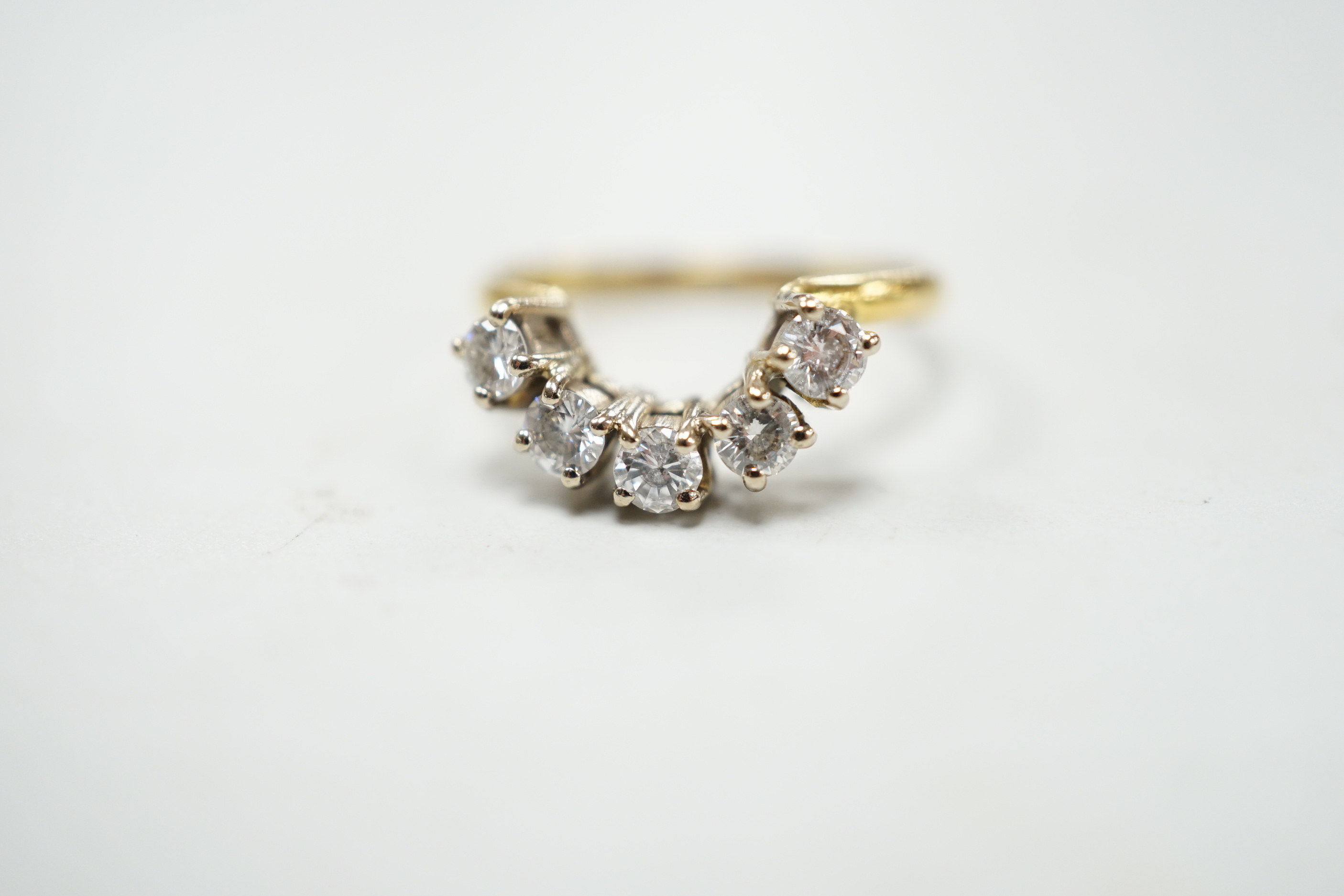 A modern 18ct gold and five stone diamond set demi-lune ring (part of a wedding set?) size M, gross 2.9 grams.